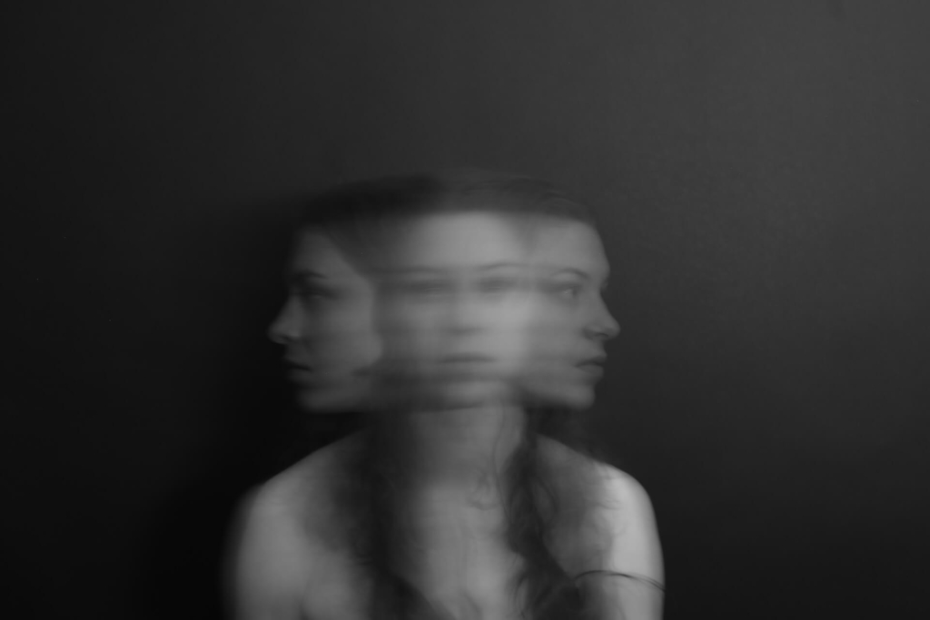 A blurry photo of a woman looking many different directions
